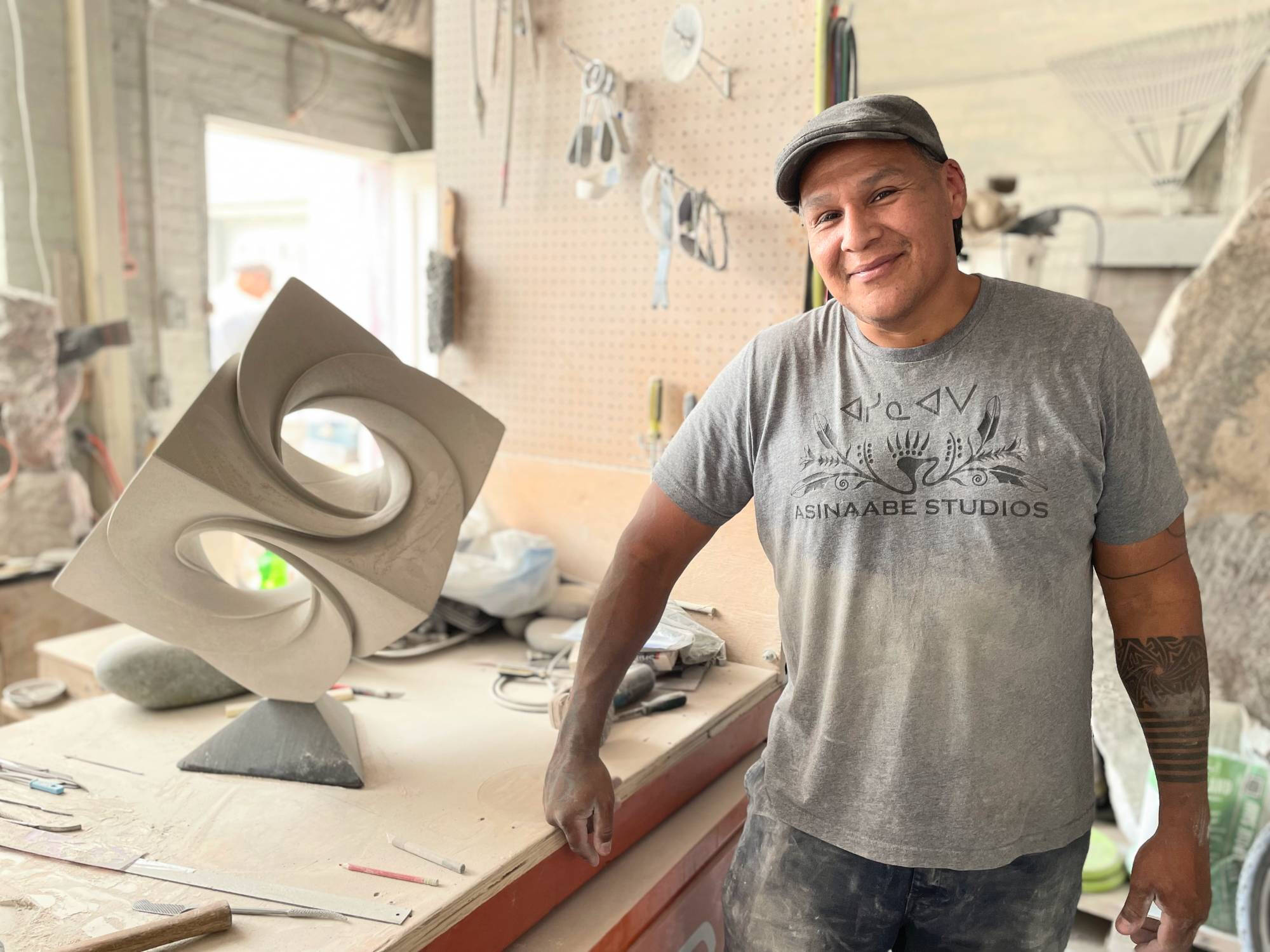 Jason Quigno with maquette of Infinity Cube at his studio Asinaabe Studios